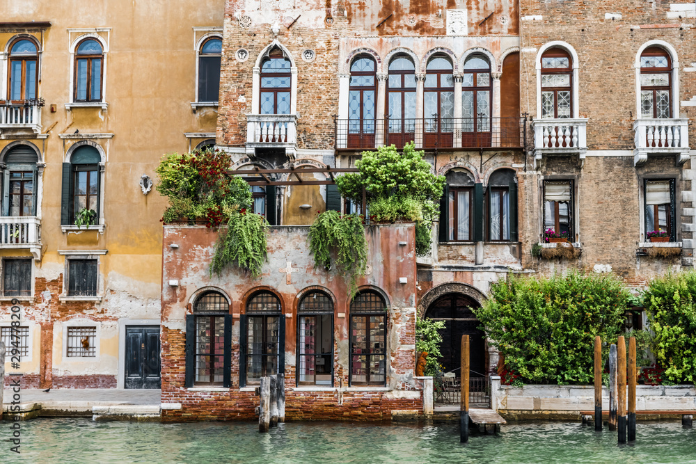 Palace on the Grand canal with lush vegetation