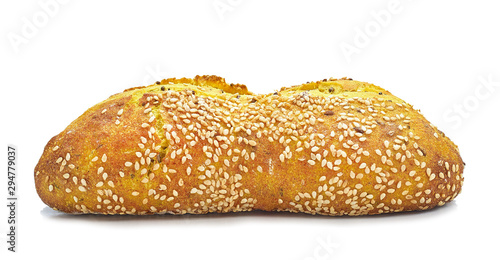 wheat bun with turmeric and sesame seeds on a white background