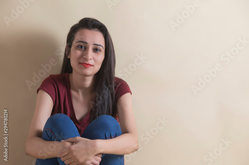 Happy young girl sitting in joy	 photo