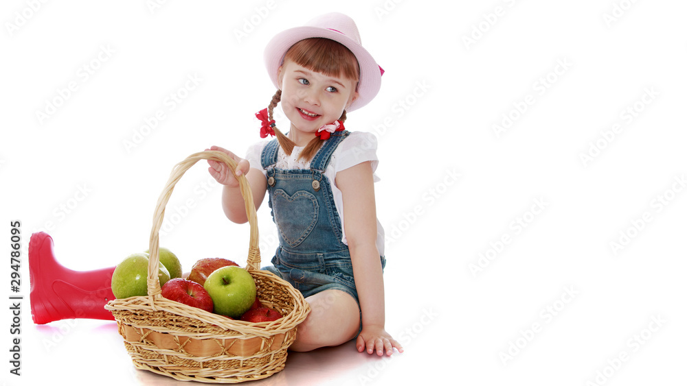 Little girl with a basket of apples.Isolated on white background Little girl with a basket of apples.Isolated on white background