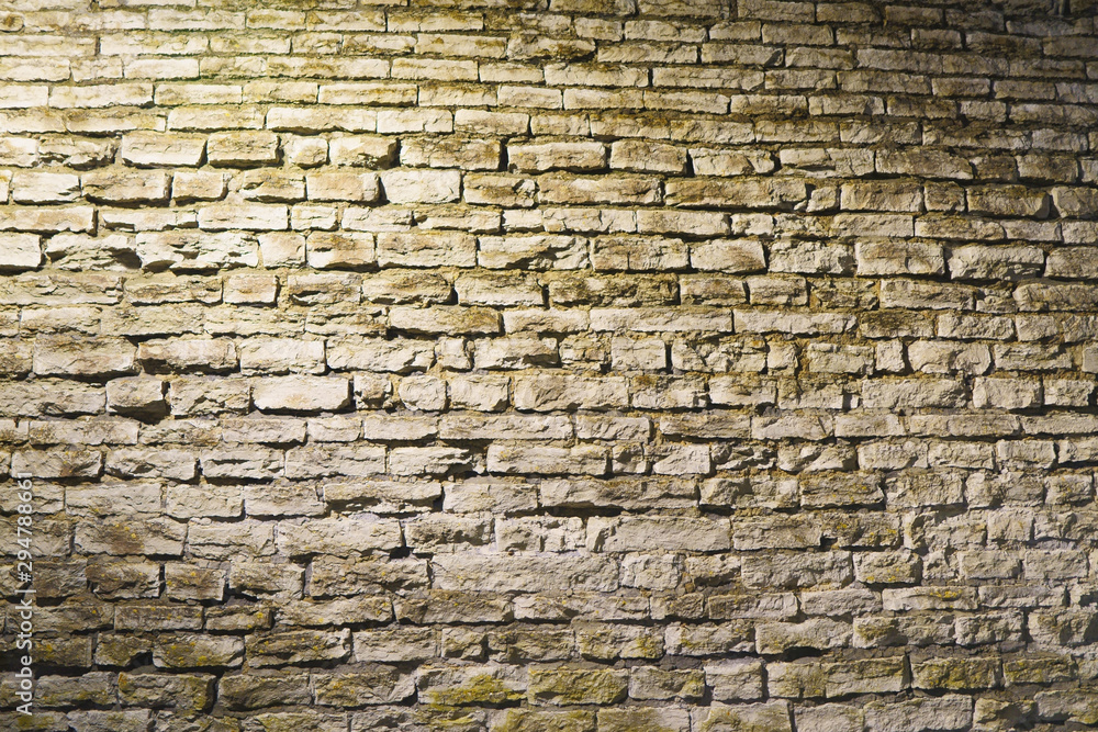 Fototapeta premium Vintage old stone wall texture. night shoot