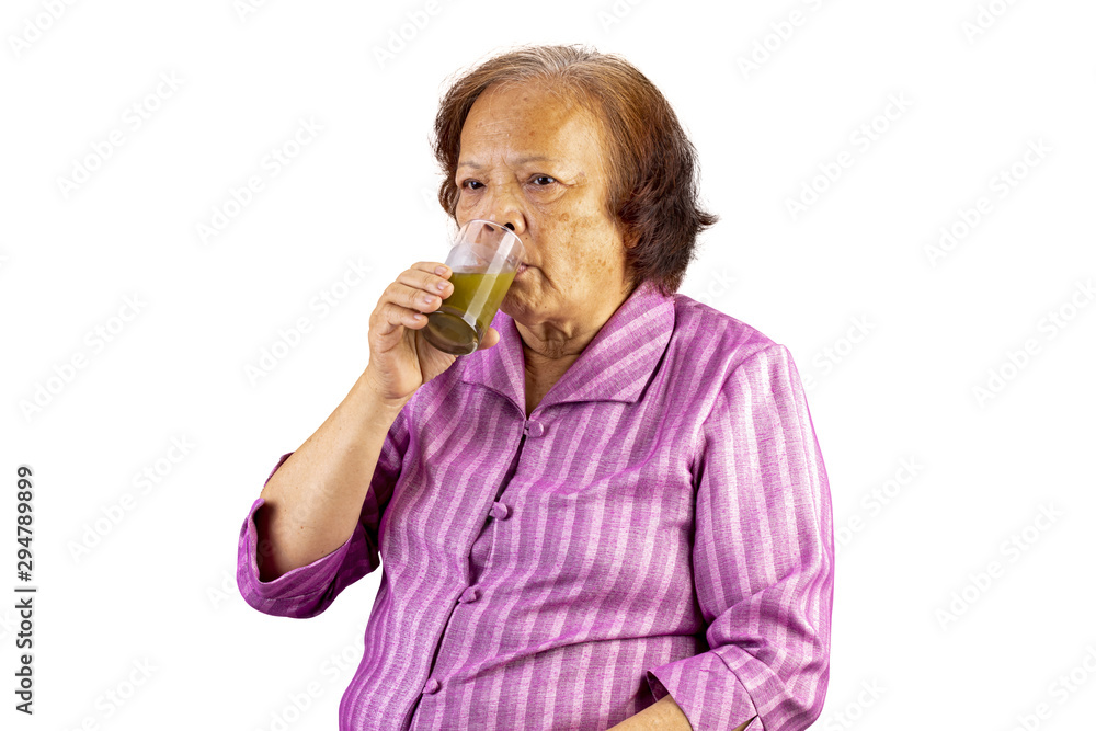 Old aged asian woman drinking green tea by using one hand isolated Old aged asian woman drinking green tea by using one hand isolated