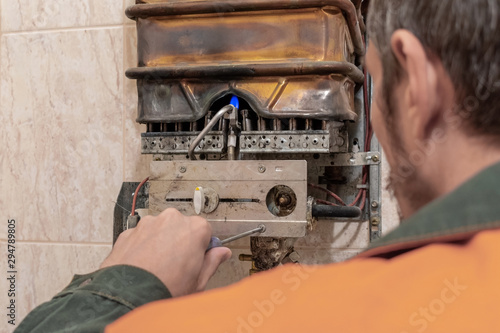 master performs maintenance of the gas boiler.