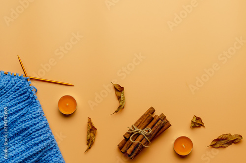 Autumn composition. knitting candle cinnamon flat lay