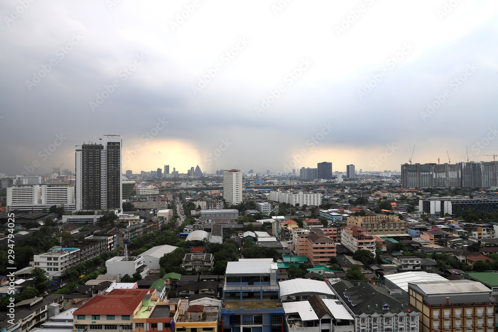 Fototapeta premium Top view of heavy rainy clouds over city of Bangkok, Thailand