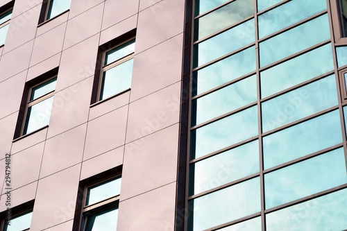 The windows of a modern building for offices. Business buildings architecture.