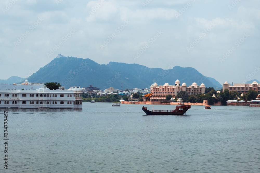 VIew of the Lake Palace, Udaipur in Lake Pichola as seen from the City palace in Udaipur, Rajasthan, India