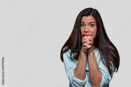 Фотография Anxious female worried and concerned, having inner conflict, stress, anxiety, is