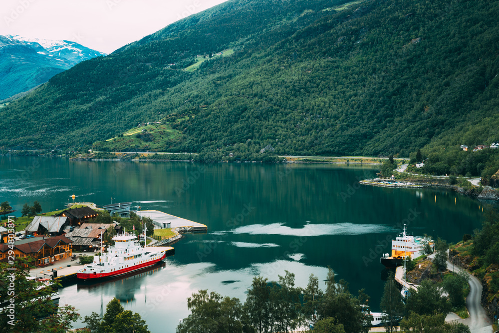 Flam, Norway. Touristic Ship Boat Moored Near Berth In Sognefjord Port. Aerial View In Summer Evening. Norwegian Longest And Deepest Fjord. Famous Natural Norwegian Landmark And Popular Destination