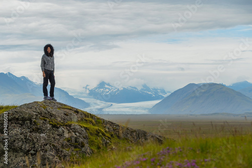 Picture of asian woman solo travel enjoy at nature on the top mountain with Skaftafellsjokull glacier as a Background in Iceland