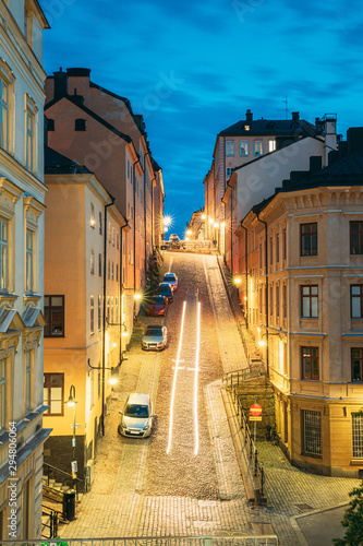 Stockholm, Sweden. Night View Of Traditional Stockholm Street. Residential Area, Cozy Street In Downtown. District Mullvaden First In Sodermalm. Cars Parked In Narrow Street.