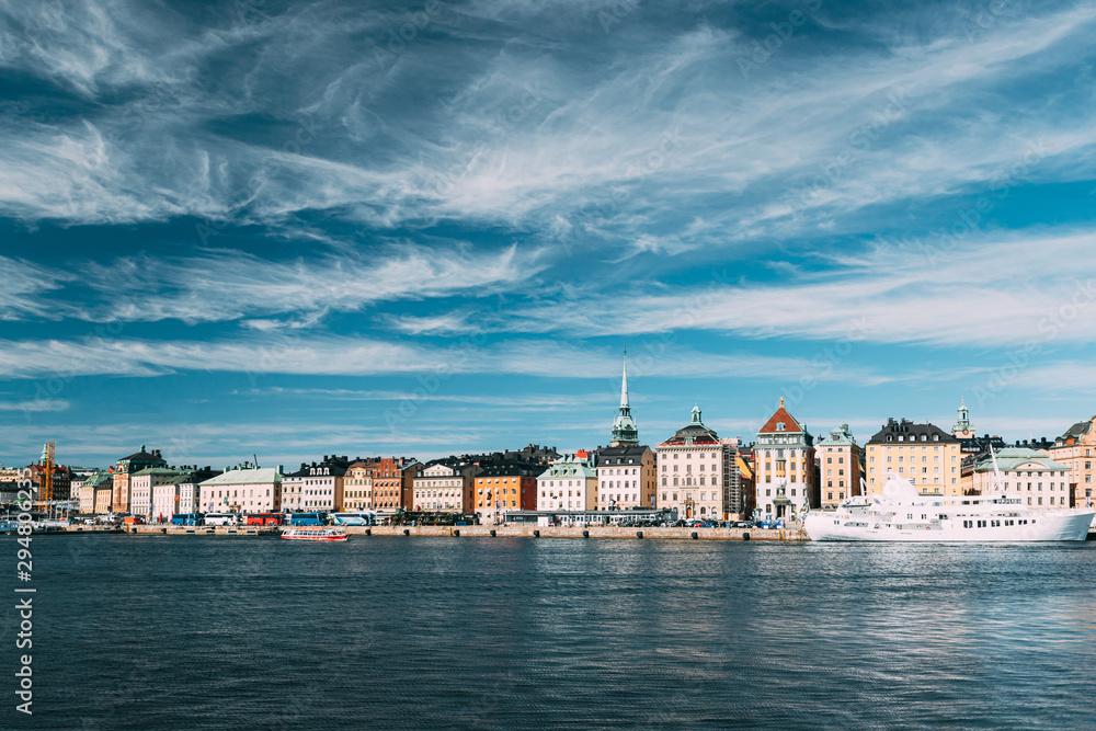 Stockholm, Sweden. Scenic Famous View Of Embankment In Old Town Of Stockholm At Summer. Gamla Stan In Summer Evening. Famous Popular Destination Scenic Place And UNESCO World Heritage Site