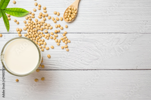 Soy milk and soy bean it on white table background,healthy concept. Benefits of Soy. photo