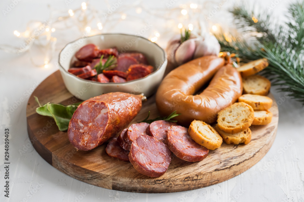 typical smoked portuguese sausages on wooden board