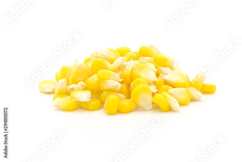 Piles of fresh corn kernels close-up isolated on white background
