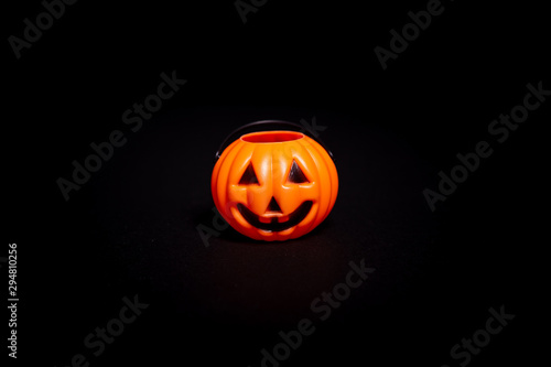 Holloween pumpkin decoration on a black background © Noemi