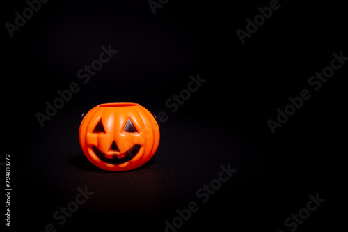 Holloween pumpkin decoration on a black background © Noemi