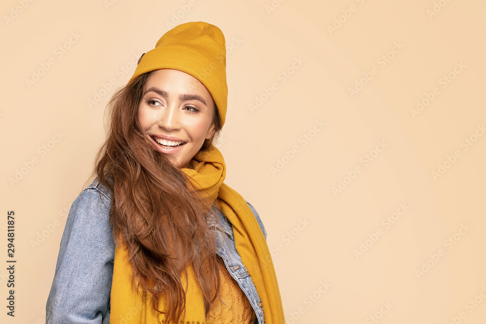 Happy girl in autumn cap and scarf. Happy girl in autumn cap and scarf.