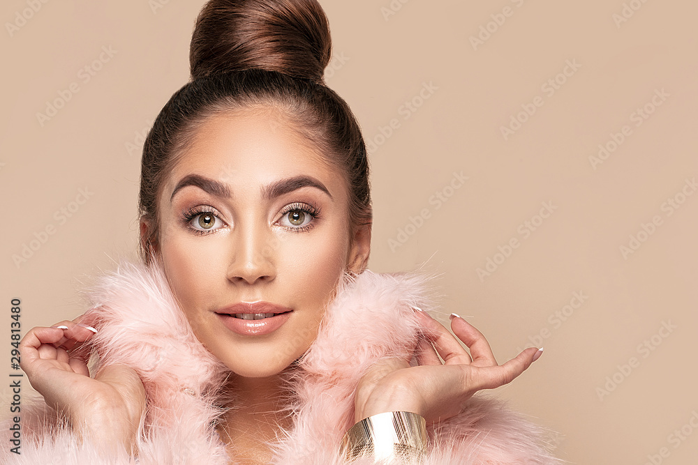 Fashionable smiling girl in pink eco fur. Fashionable smiling girl in pink eco fur.