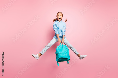 Summer. Full size photo of pretty little lady jumping high enjoy last studying day wear teal pupil backpack casual sweater clothes isolated pink color background photo