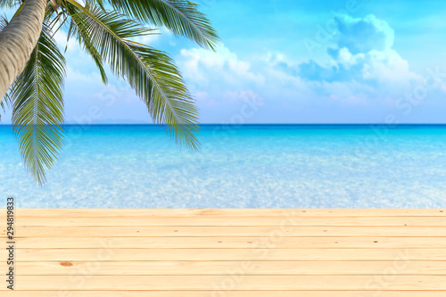  wooden table top on blurred beach background for product display.