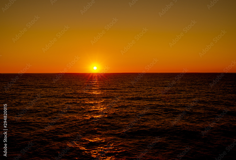 sunset over the ocean with an endless horizon 