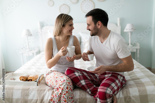 Romantic young couple having fun in bedroom