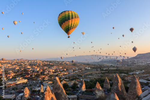 Sunrise in Cappadocia. Hot air baloons flying over the valley