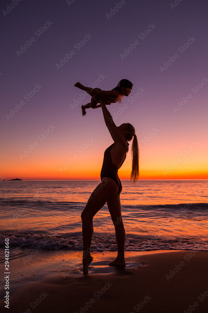 Mother and daughter at the sea