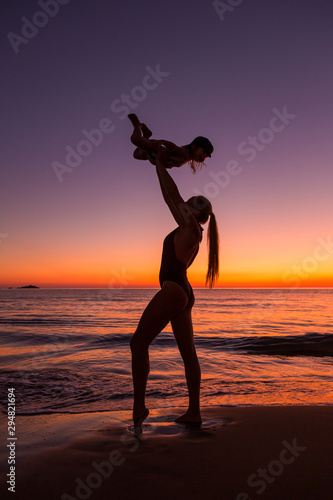 Mother and daughter at the sea 