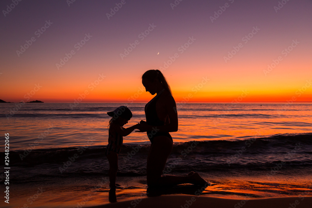 Mother and daughter at the sea