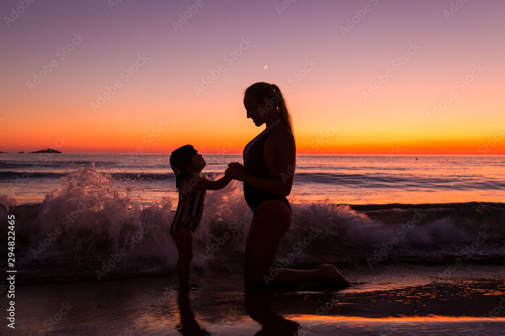 Mother and daughter at the sea