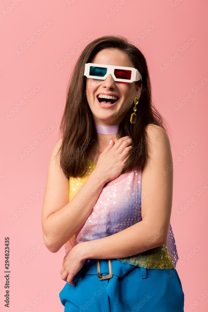 happy young stylish disco girl in 3d glasses isolated on pink