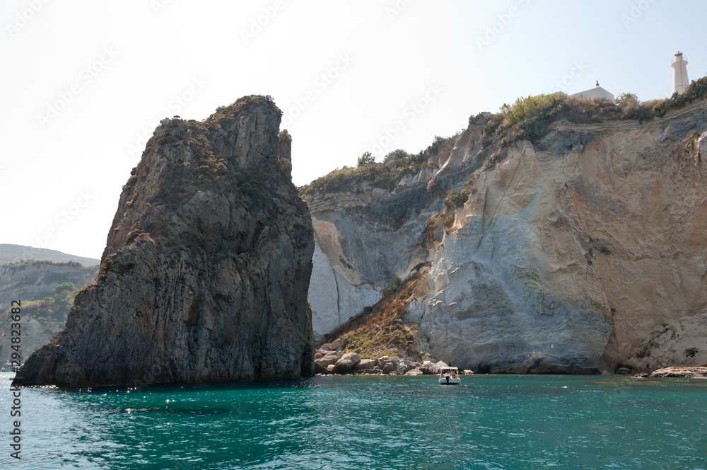 Rocky cliff (Faraglioni della Madonna) with the peak of the Mediterranean sea of the island of Ponza in Italy. Rocks in the sea.