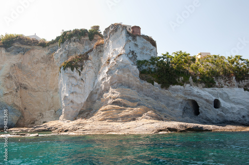 Beautiful rocks of the island of Ponza in Italy in the summer. Caves in the rocks of the island