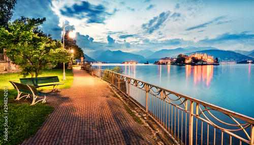 Fototapeta Naklejka Na Ścianę i Meble -  Splendid evening cityscape of Stresa town. Wonderful summer susnset on Maggiore lake with Bella island on background, Province of Verbano-Cusio-Ossola, Italy, Europe. Traveling concept background.