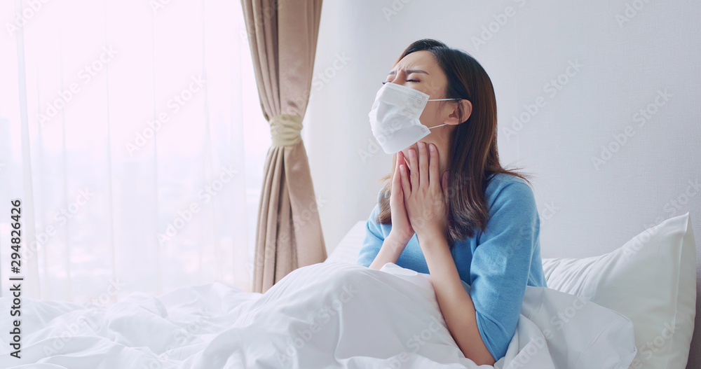 asian woman cough in bedroom