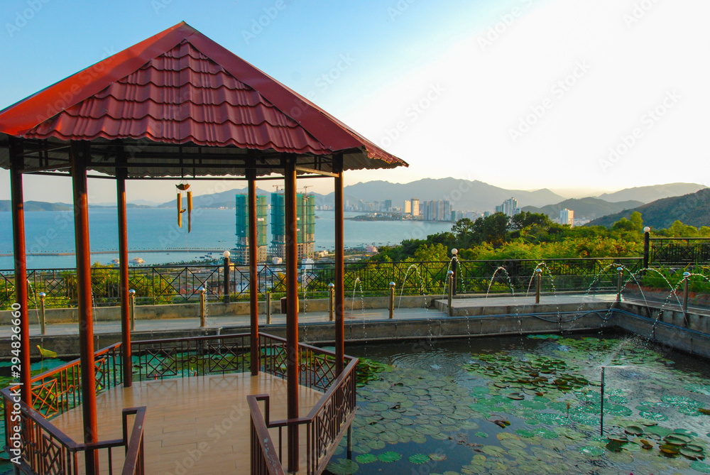 Garden of Dao temple with view of Nha Trang city behind, Vietnam Garden of Dao temple with view of Nha Trang city behind, Vietnam