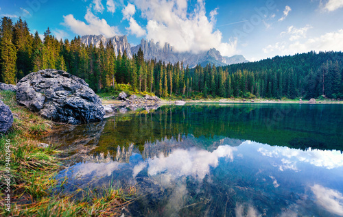 Fototapeta Naklejka Na Ścianę i Meble -  Stunning summer view of Carezza (Karersee) lake. Wonderful morning scene of Dolomiti Alps, Province of Bolzano, South Tyrol, Italy, Europe. Beauty of nature concept background.