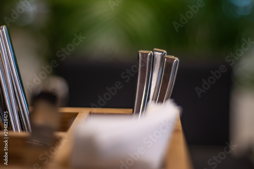 cutlery in a wooden stand