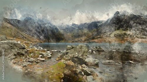 Digital watercolor painting of Beautiful moody Winter landscape image of Llyn Idwal and snowcapped Glyders Mountain Range in Snowdonia