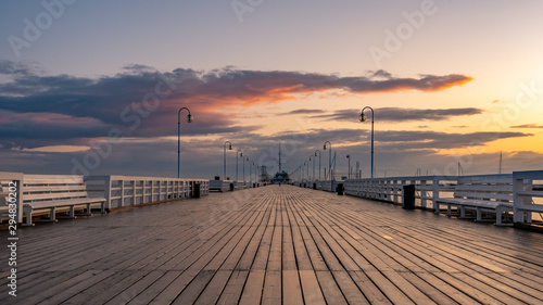 Fototapeta Naklejka Na Ścianę i Meble -  The Sopot Pier in the city of Sopot. The pier is the longest wooden pier in Europe. Beautiful sunrise. October.
