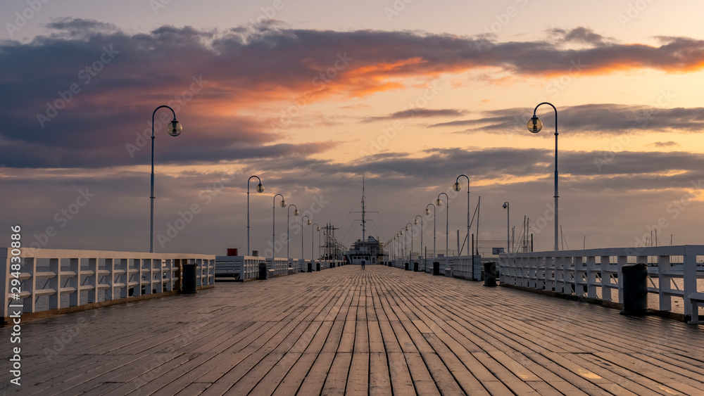 The Sopot Pier in the city of Sopot. The pier is the longest wooden pier in Europe. Beautiful sunrise. October.