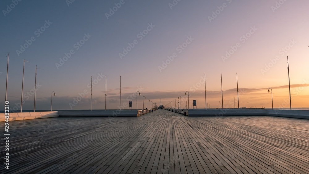 The Sopot Pier in the city of Sopot. The pier is the longest wooden pier in Europe. Beautiful sunrise. October.