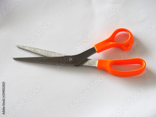 stainless steel Scissors handle is made of plastic orange color