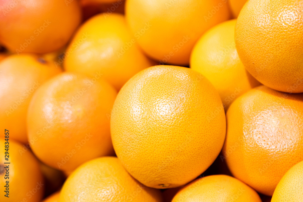 Grapefruit harvest. pile of grapefruit. grapefruits for food textures and backgrounds. A backdrop of grapefruits. Street vegetable farmer's market Grapefruit harvest. pile of grapefruit. grapefruits for food textures and backgrounds. A backdrop of grapefruits. Street vegetable farmer's market