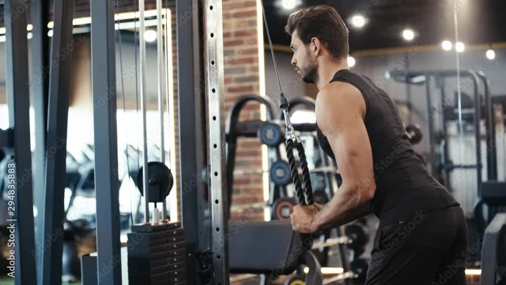 bearded sportsman exercising in gym bearded sportsman exercising in gym