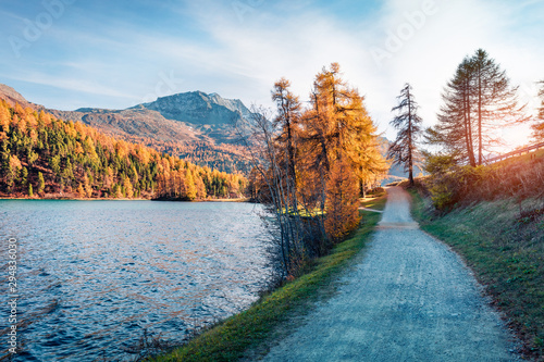 Picturesque autumn sunset on Sils Lake / Silsersee. Spectacular evening view of Swiss Alps, Maloja Region, Upper Engadine, Switzerpand, Europe. Beauty of nature concept background.