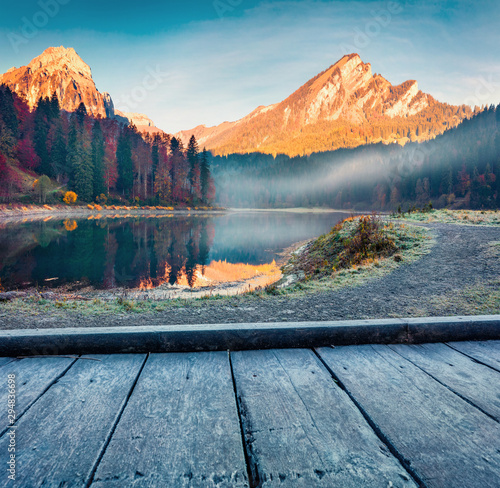 Foggy autumn sunrise on Obersee lake, Nafels village location. Amazing morning scene of Swiss Alps, canton of Glarus in Switzerland, Europe. Beauty of nature concept background. photo