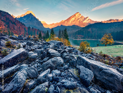 Exciting autumn sunrise on Obersee lake, Nafels village location. Amazing morning scene of Swiss Alps, canton of Glarus in Switzerland, Europe. Beauty of nature concept background. photo